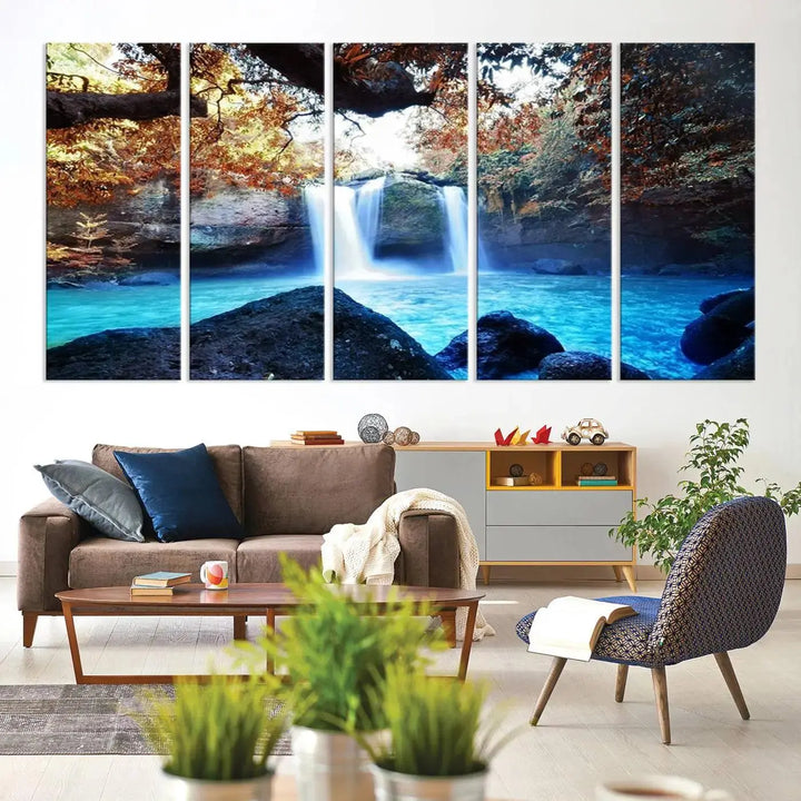 In the living room, a hand-assembled triptych titled "Wall Art Waterfall Canvas Print Great Double Waterfalls with Bright Water in Forest" is displayed on museum-quality canvas.