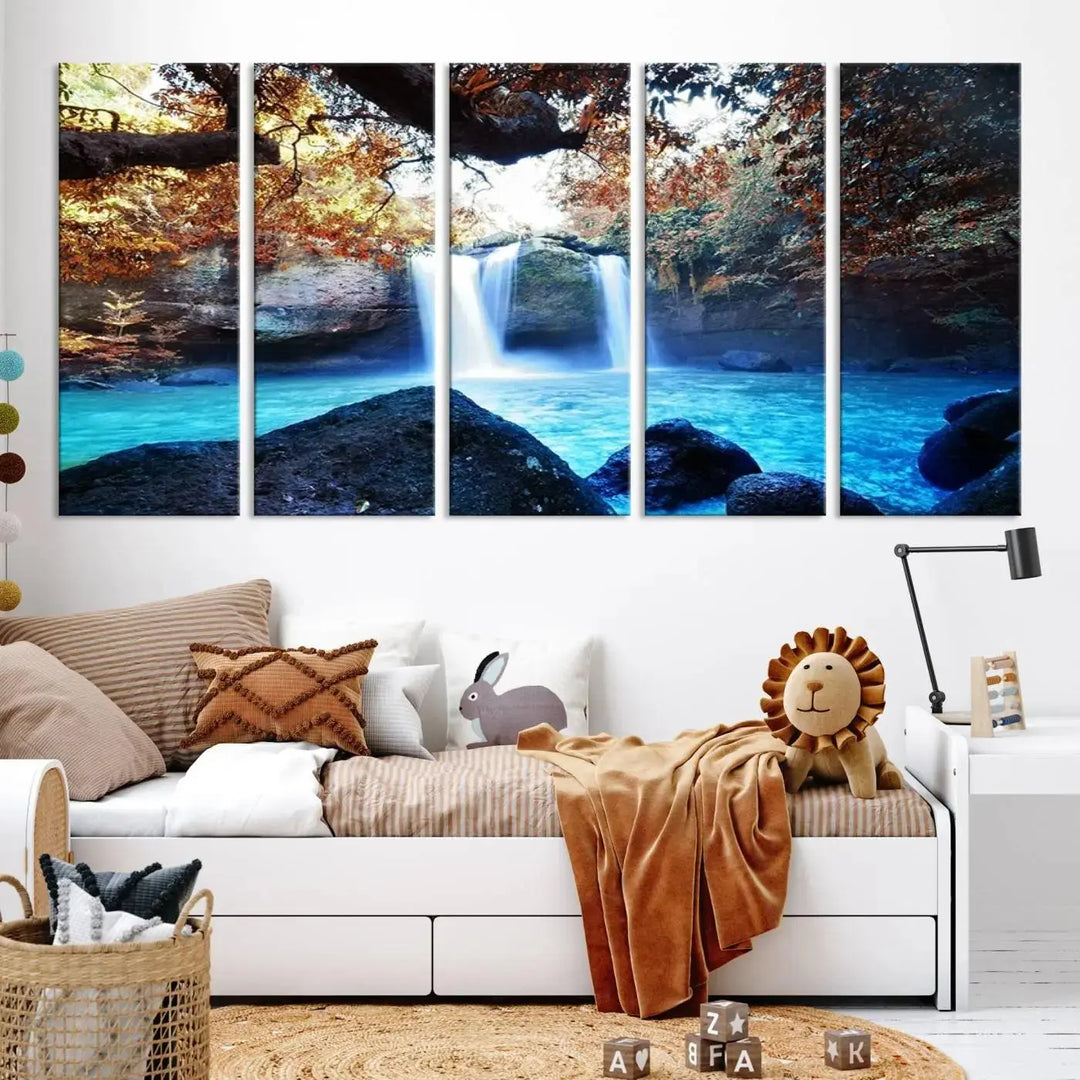 In the living room, a hand-assembled triptych titled "Wall Art Waterfall Canvas Print Great Double Waterfalls with Bright Water in Forest" is displayed on museum-quality canvas.