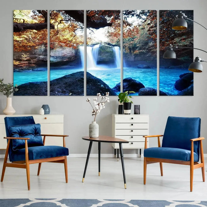 In the living room, a hand-assembled triptych titled "Wall Art Waterfall Canvas Print Great Double Waterfalls with Bright Water in Forest" is displayed on museum-quality canvas.