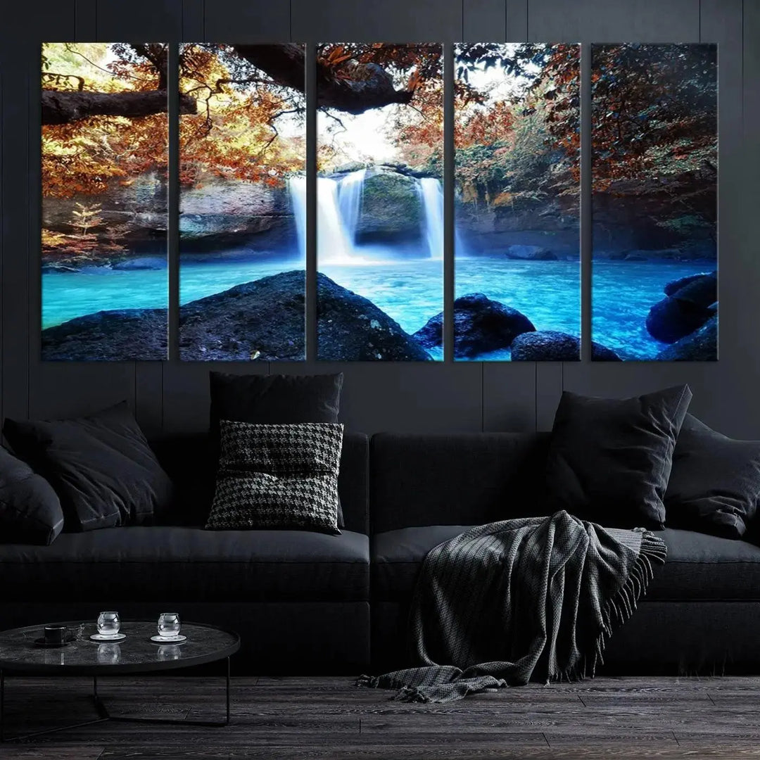 In the living room, a hand-assembled triptych titled "Wall Art Waterfall Canvas Print Great Double Waterfalls with Bright Water in Forest" is displayed on museum-quality canvas.