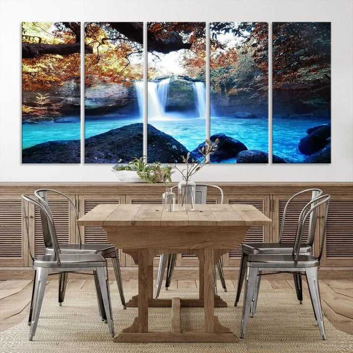 In the living room, a hand-assembled triptych titled "Wall Art Waterfall Canvas Print Great Double Waterfalls with Bright Water in Forest" is displayed on museum-quality canvas.