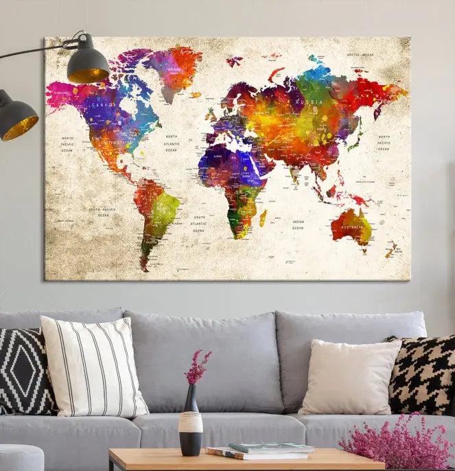 The Wall Art World Map Canvas Print features a three-panel design with vibrant colors and is coated with UV protection for museum quality, creating a stunning focal point in an elegantly styled, neutral-toned living room.