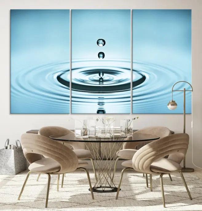 Modern living room featuring the "Water Drop Wall Art Canvas Print" depicting water droplets above ripples on museum-quality canvas on the wall.