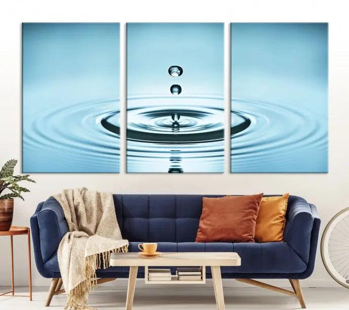 Modern living room featuring the "Water Drop Wall Art Canvas Print" depicting water droplets above ripples on museum-quality canvas on the wall.