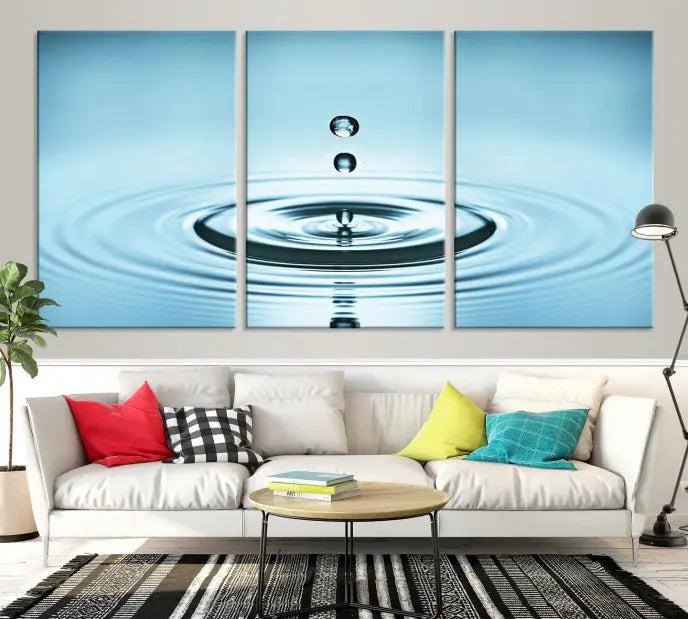 Modern living room featuring the "Water Drop Wall Art Canvas Print" depicting water droplets above ripples on museum-quality canvas on the wall.