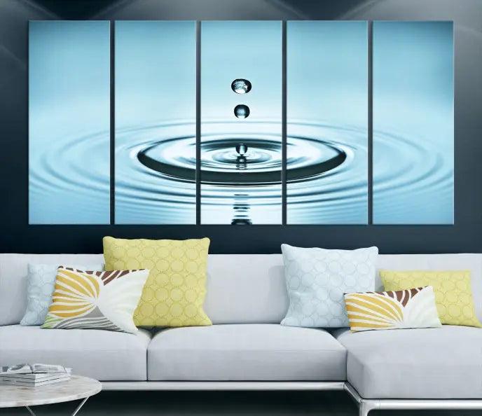 Modern living room featuring the "Water Drop Wall Art Canvas Print" depicting water droplets above ripples on museum-quality canvas on the wall.