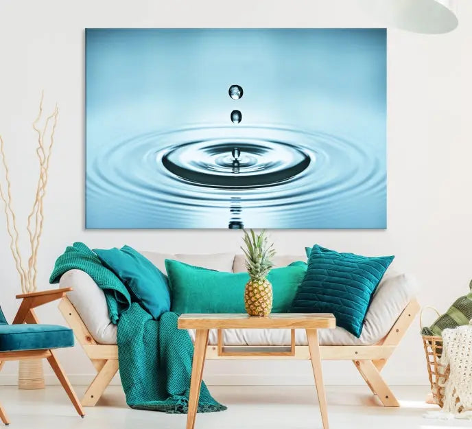 A modern living room showcases a gallery-wrapped triptych of the Water Droplet Wall Art Canvas Print.