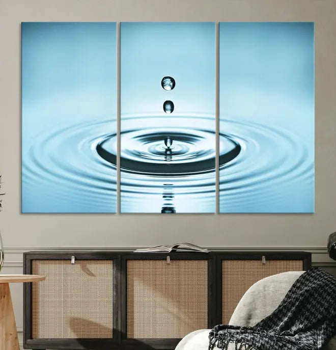 A modern living room showcases a gallery-wrapped triptych of the Water Droplet Wall Art Canvas Print.