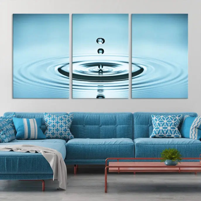 A modern living room showcases a gallery-wrapped triptych of the Water Droplet Wall Art Canvas Print.