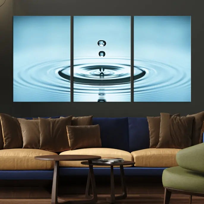 A modern living room showcases a gallery-wrapped triptych of the Water Droplet Wall Art Canvas Print.