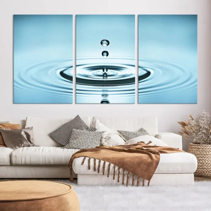 A modern living room showcases a gallery-wrapped triptych of the Water Droplet Wall Art Canvas Print.