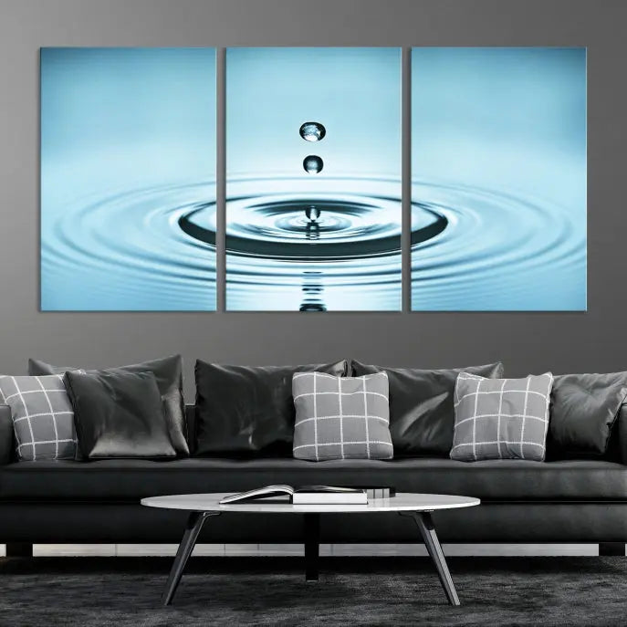 A modern living room showcases a gallery-wrapped triptych of the Water Droplet Wall Art Canvas Print.