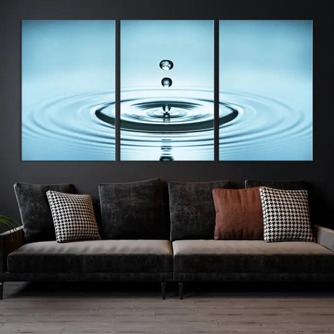 A modern living room showcases a gallery-wrapped triptych of the Water Droplet Wall Art Canvas Print.