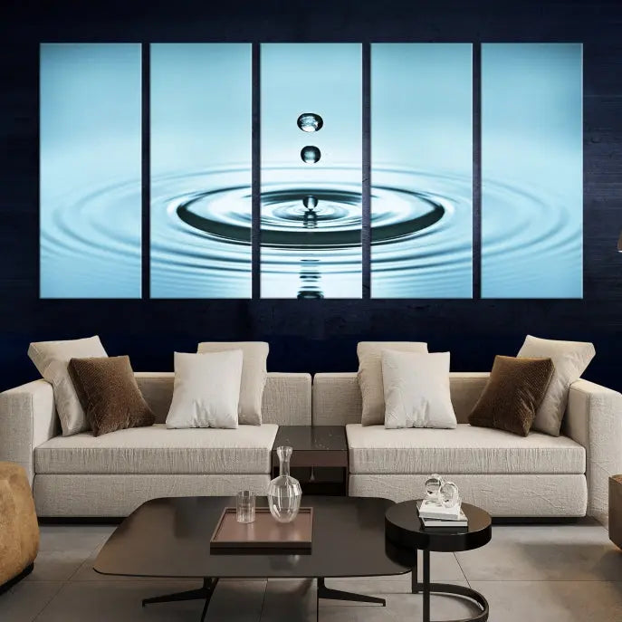 A modern living room showcases a gallery-wrapped triptych of the Water Droplet Wall Art Canvas Print.