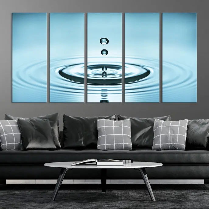 A modern living room showcases a gallery-wrapped triptych of the Water Droplet Wall Art Canvas Print.