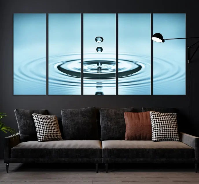 A modern living room showcases a gallery-wrapped triptych of the Water Droplet Wall Art Canvas Print.