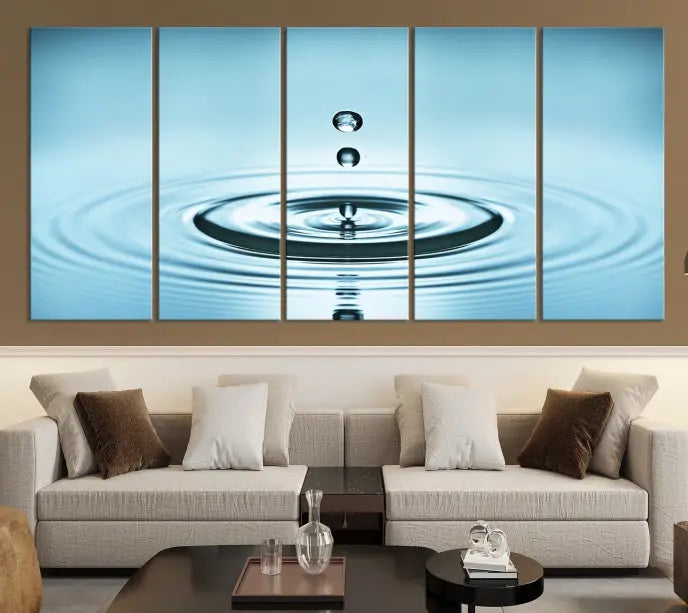 A modern living room showcases a gallery-wrapped triptych of the Water Droplet Wall Art Canvas Print.