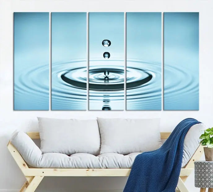 A modern living room showcases a gallery-wrapped triptych of the Water Droplet Wall Art Canvas Print.