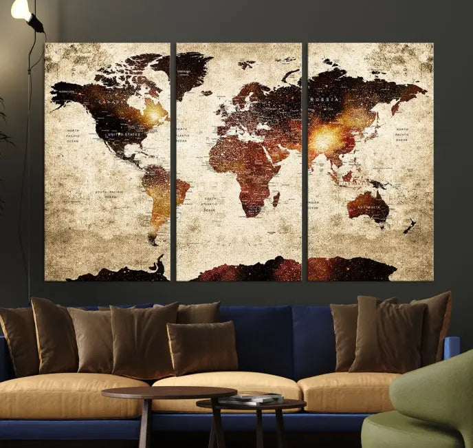 The Watercolor Push Pin World Map Wall Art Canvas Print, featuring three panels with a vintage style, is displayed on the wall. Warm lighting enhances its appearance.