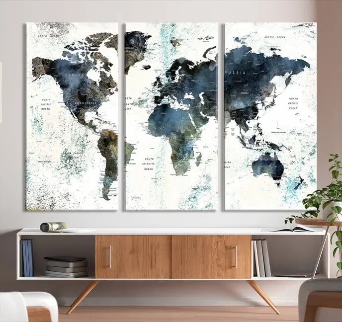 The "Watercolor Push Pin World Map Wall Art Canvas Print" displayed on the wall is a triptych crafted with museum-quality canvases. It contributes to the elegant ambiance with its modern and minimalist decor, featuring a UV-protective coating to maintain its vibrant allure.