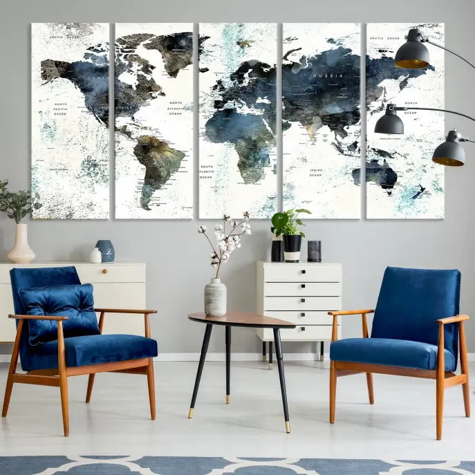 The "Watercolor Push Pin World Map Wall Art Canvas Print" displayed on the wall is a triptych crafted with museum-quality canvases. It contributes to the elegant ambiance with its modern and minimalist decor, featuring a UV-protective coating to maintain its vibrant allure.