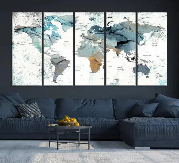 The Watercolor Push Pin World Map Wall Art, a world map painting on museum-quality canvas in blue and gray hues with a UV-protective coating, hangs prominently in the room.