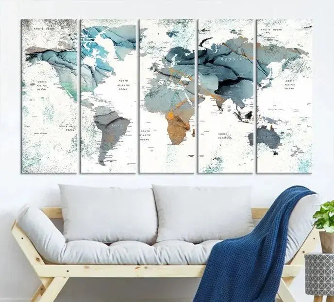 The Watercolor Push Pin World Map Wall Art, a world map painting on museum-quality canvas in blue and gray hues with a UV-protective coating, hangs prominently in the room.