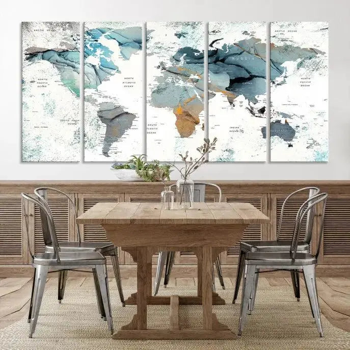 The Watercolor Push Pin World Map Wall Art, a world map painting on museum-quality canvas in blue and gray hues with a UV-protective coating, hangs prominently in the room.