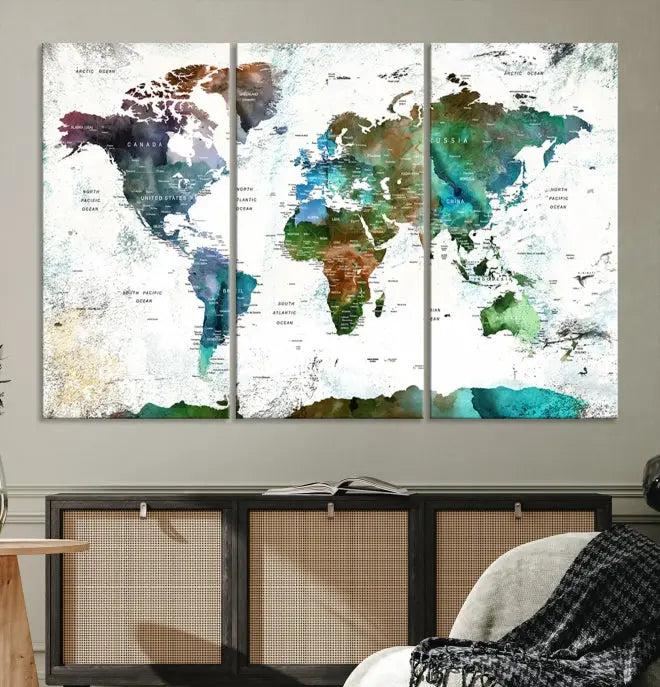 A cozy living room showcasing the Watercolor World Map Canvas Print.