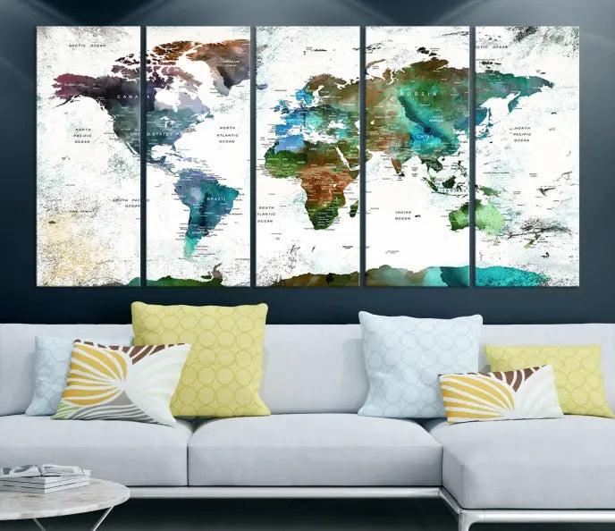 A cozy living room showcasing the Watercolor World Map Canvas Print.