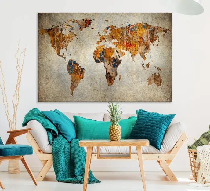 A triptych of Watercolor World Map Canvas Wall Art Prints is displayed in a dimly lit room.