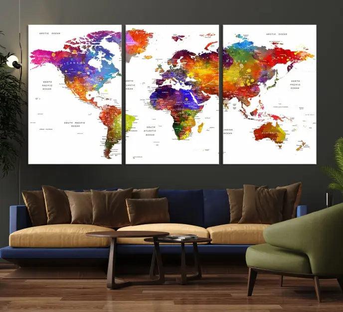 In this stylish living room, a vibrant Watercolor World Map Push Pin Poster Print, enhanced with a satin varnish for extra elegance, is displayed prominently.