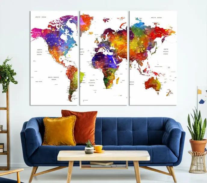 In this stylish living room, a vibrant Watercolor World Map Push Pin Poster Print, enhanced with a satin varnish for extra elegance, is displayed prominently.