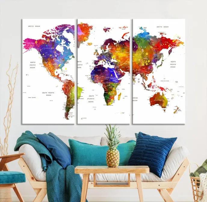 In this stylish living room, a vibrant Watercolor World Map Push Pin Poster Print, enhanced with a satin varnish for extra elegance, is displayed prominently.