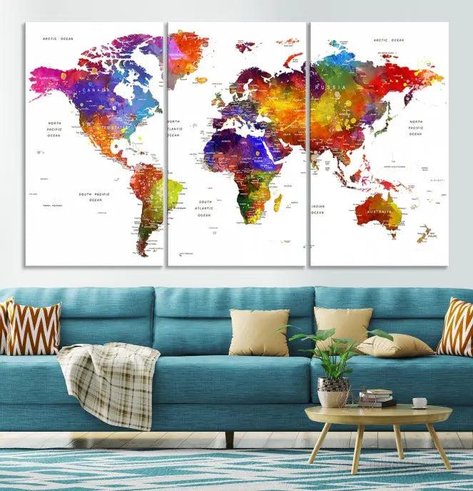 In this stylish living room, a vibrant Watercolor World Map Push Pin Poster Print, enhanced with a satin varnish for extra elegance, is displayed prominently.