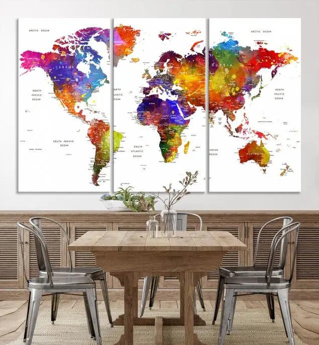 In this stylish living room, a vibrant Watercolor World Map Push Pin Poster Print, enhanced with a satin varnish for extra elegance, is displayed prominently.