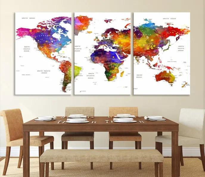 In this stylish living room, a vibrant Watercolor World Map Push Pin Poster Print, enhanced with a satin varnish for extra elegance, is displayed prominently.