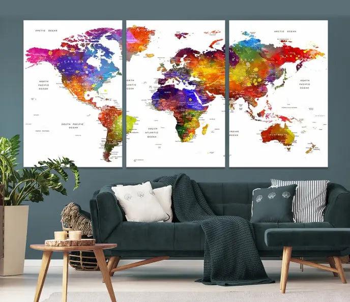 In this stylish living room, a vibrant Watercolor World Map Push Pin Poster Print, enhanced with a satin varnish for extra elegance, is displayed prominently.