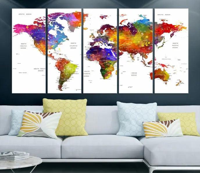 In this stylish living room, a vibrant Watercolor World Map Push Pin Poster Print, enhanced with a satin varnish for extra elegance, is displayed prominently.