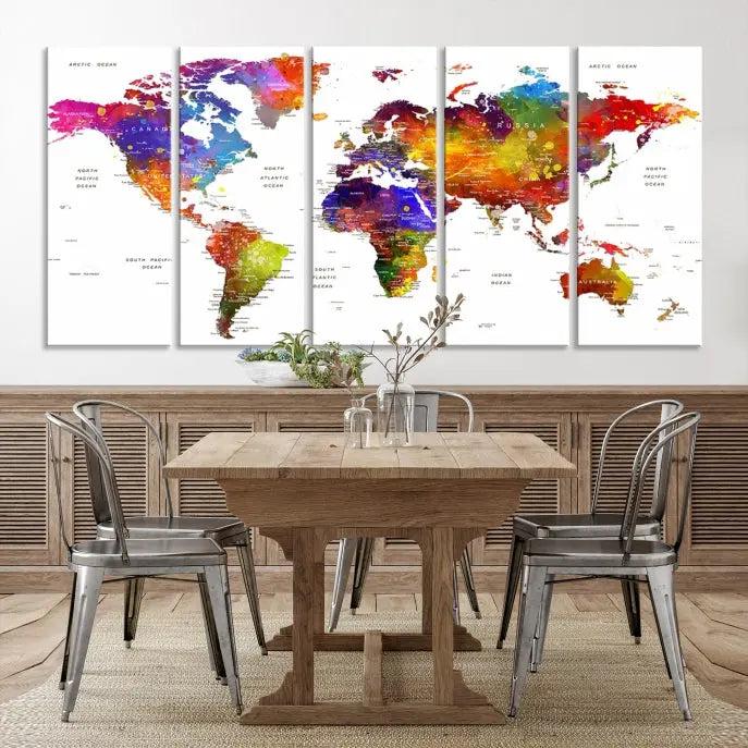 In this stylish living room, a vibrant Watercolor World Map Push Pin Poster Print, enhanced with a satin varnish for extra elegance, is displayed prominently.