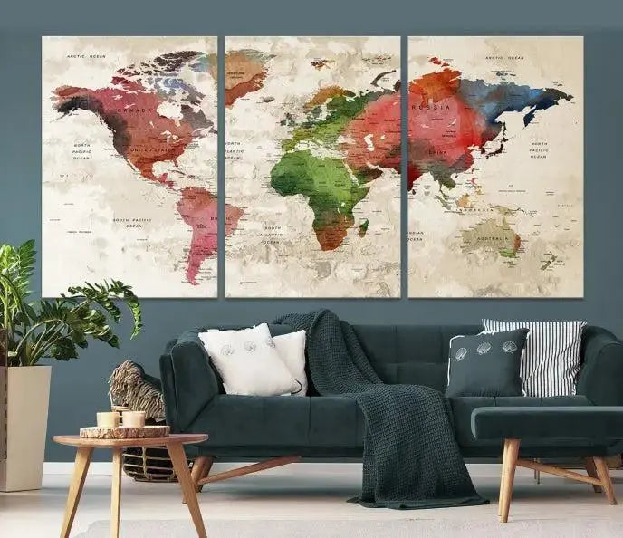 A triptych of the "Watercolor World Map Push Pin Travel Lover Wall Art Canvas Print," featuring a museum-quality canvas and gallery wrapping, decorates the wall. Its longevity is ensured by a UV-protective coating.