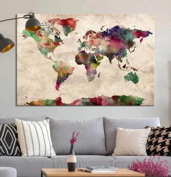 A triptych of the Watercolor World Map Wall Art Canvas Print, crafted on museum-quality polycotton canvas with UV-protective coating for lasting vibrancy, enhances the space in this modern room. Ready to hang and admire, it adds an artistic touch to any setting.