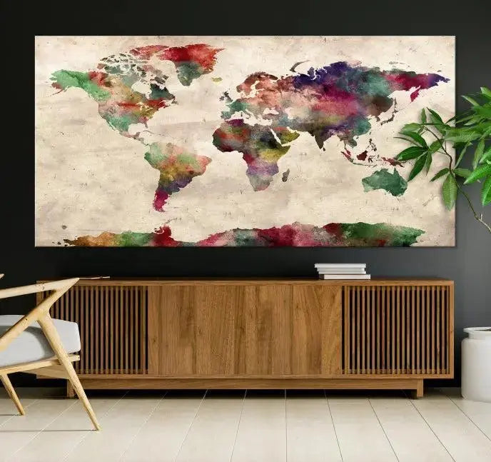 A triptych of the Watercolor World Map Wall Art Canvas Print, crafted on museum-quality polycotton canvas with UV-protective coating for lasting vibrancy, enhances the space in this modern room. Ready to hang and admire, it adds an artistic touch to any setting.