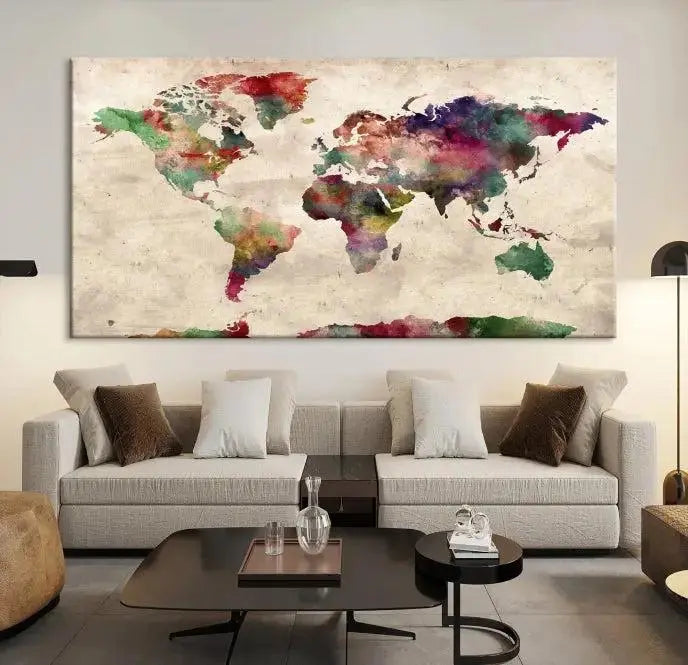 A triptych of the Watercolor World Map Wall Art Canvas Print, crafted on museum-quality polycotton canvas with UV-protective coating for lasting vibrancy, enhances the space in this modern room. Ready to hang and admire, it adds an artistic touch to any setting.