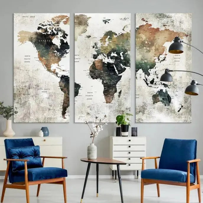 The dark wall is elegantly adorned with the Watercolor World Map Wall Art Canvas Print in a triptych style. Each canvas features a UV-protective coating and is ready to hang, seamlessly blending sophistication with practicality.