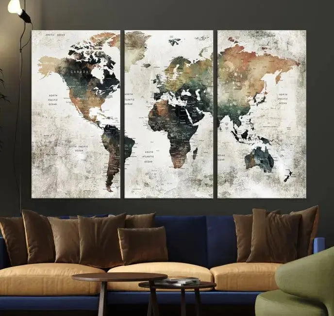 The dark wall is elegantly adorned with the Watercolor World Map Wall Art Canvas Print in a triptych style. Each canvas features a UV-protective coating and is ready to hang, seamlessly blending sophistication with practicality.