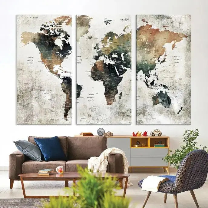 The dark wall is elegantly adorned with the Watercolor World Map Wall Art Canvas Print in a triptych style. Each canvas features a UV-protective coating and is ready to hang, seamlessly blending sophistication with practicality.