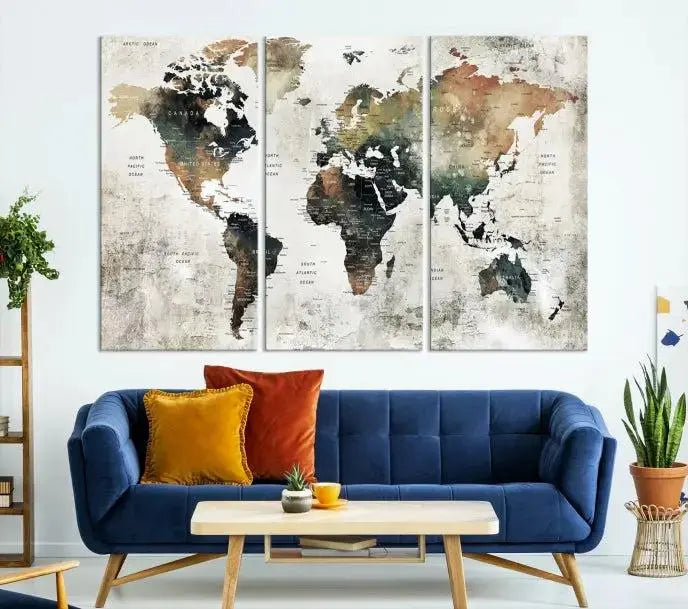 The dark wall is elegantly adorned with the Watercolor World Map Wall Art Canvas Print in a triptych style. Each canvas features a UV-protective coating and is ready to hang, seamlessly blending sophistication with practicality.