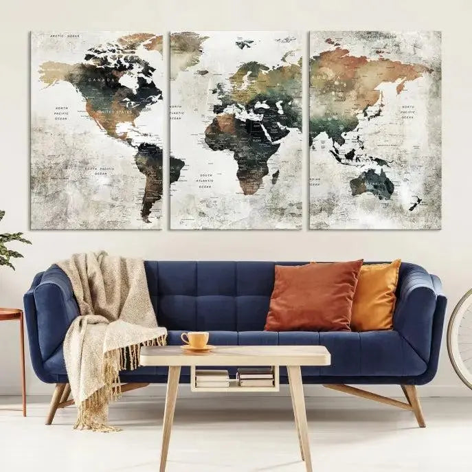 The dark wall is elegantly adorned with the Watercolor World Map Wall Art Canvas Print in a triptych style. Each canvas features a UV-protective coating and is ready to hang, seamlessly blending sophistication with practicality.