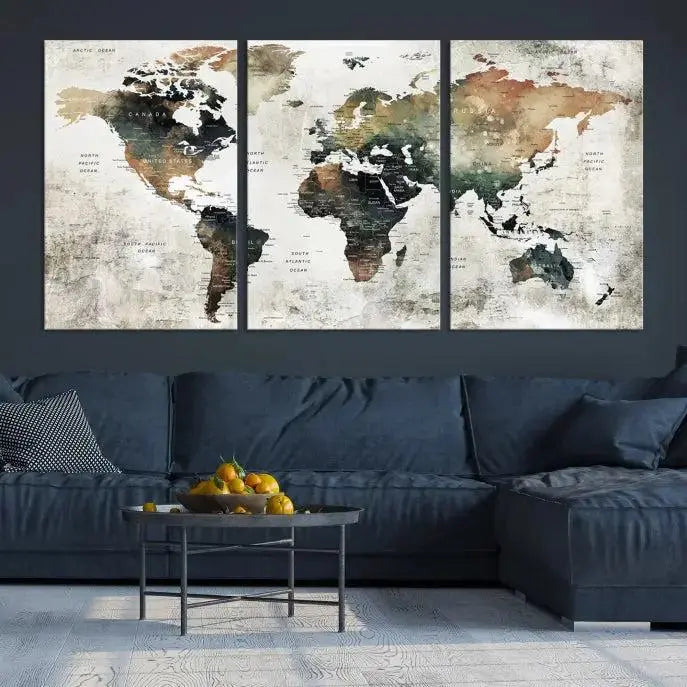 The dark wall is elegantly adorned with the Watercolor World Map Wall Art Canvas Print in a triptych style. Each canvas features a UV-protective coating and is ready to hang, seamlessly blending sophistication with practicality.